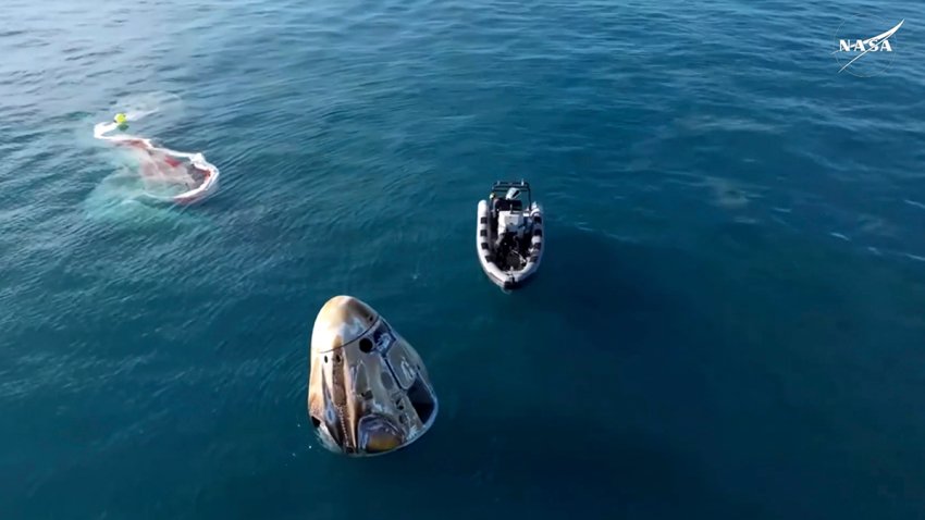 In this image taken from video provided by NASA, a SpaceX capsule floats in the over the Gulf of Mexico, Tuesday, March 18, 2025, after landing off the coast of Florida.