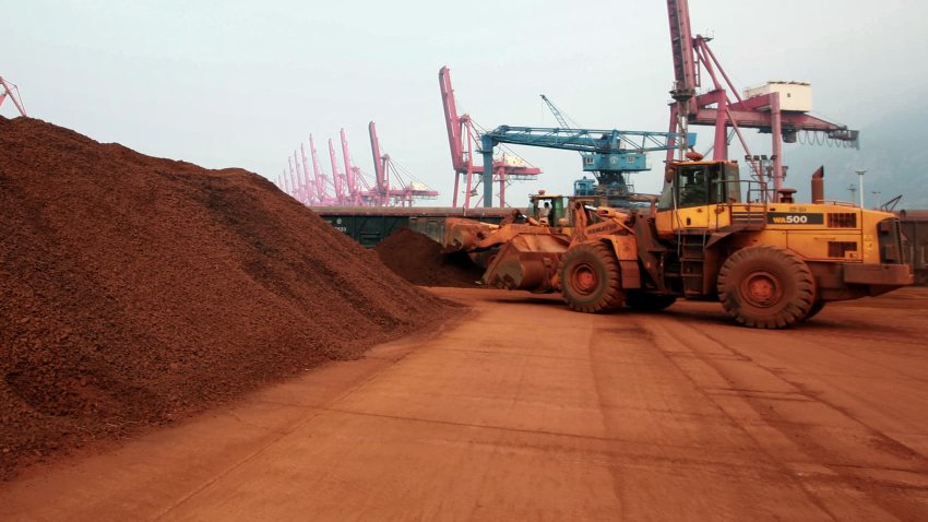 A front loader shifts soil containing rare earth minerals to be loaded in Lianyungang, China, which accounts for about 90 percent of the world’s rare earth production.